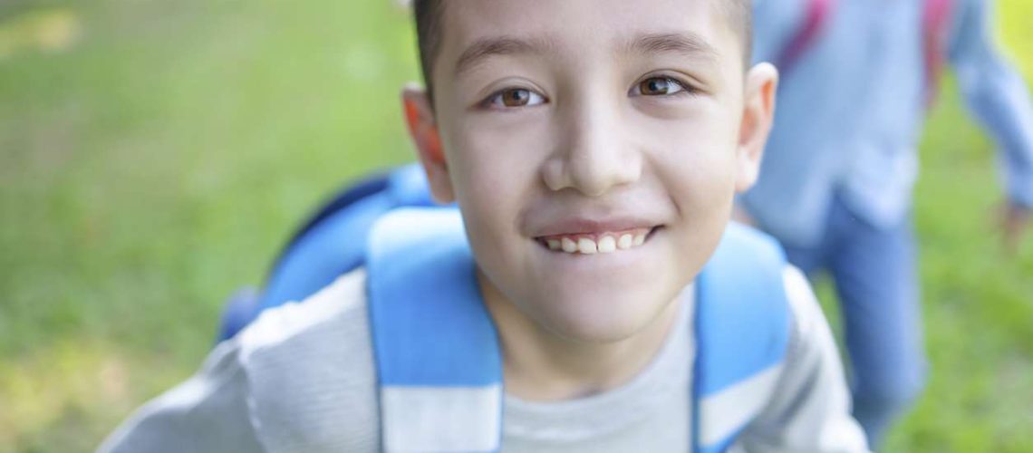 closeup naughty boy  running on the grass