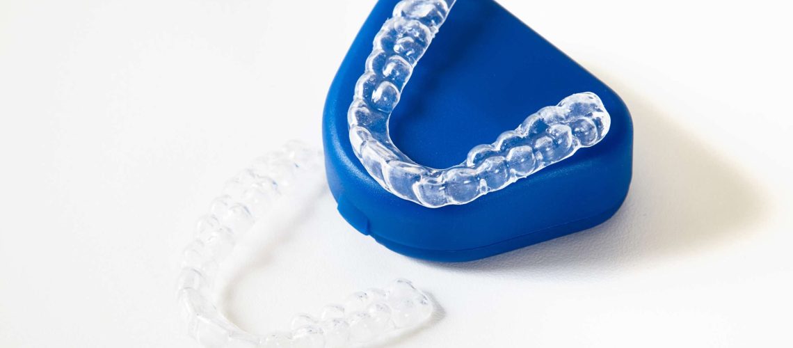 two dental whitening trays and a box for it